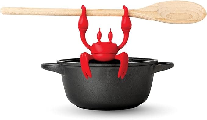 Red crab-shaped silicone spoon holder and steam releaser for fun kitchen cooking
