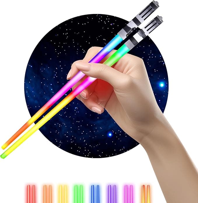 Pair of glowing LED lightsaber chopsticks lighting up in blue and red over a sushi platter, ready for a galactic food battle.