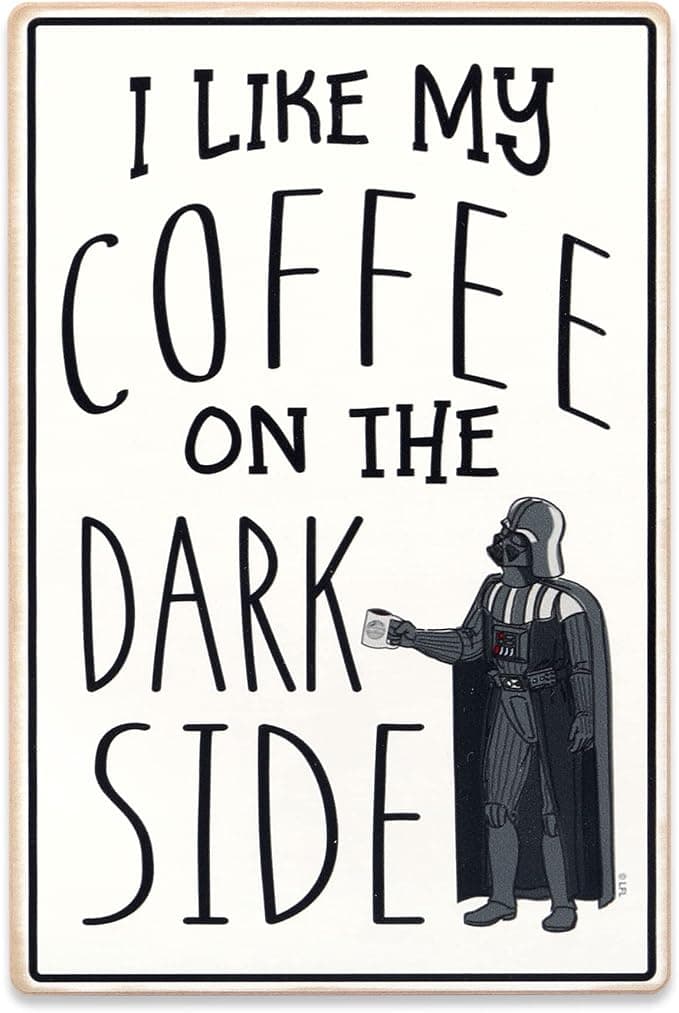 Wooden wall sign with Darth Vader and the quote “I Like My Coffee on the Dark Side,” hanging above a coffee station like a Sith-approved espresso command center.