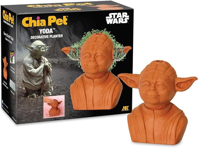 Chia Pet planter shaped like Yoda sprouting green chia “hair,” sitting proudly on a windowsill like a wise, leafy garden guardian.