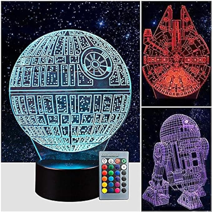Colorful 3D illusion night light projecting R2-D2, the Death Star, and Millennium Falcon, glowing in a dark room like bedtime magic from a galaxy far, far away.