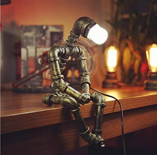 Retro industrial steampunk robot desk lamp with bronze pipes and Edison bulbs—quirky lighting gift for tinkerers and decor rebels.