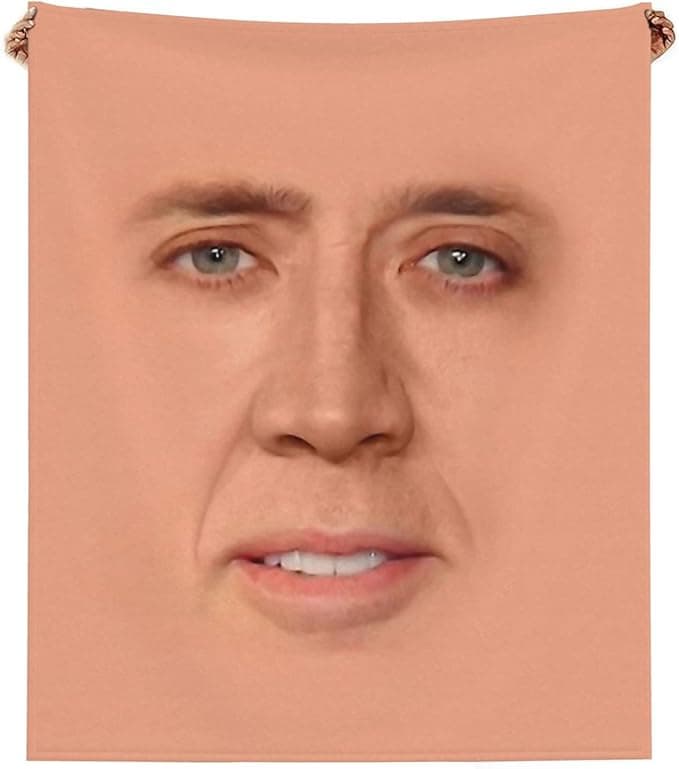 Soft fleece throw blanket printed with Nicholas Cage’s face—funny, cozy home decor for couches, beds, or cult-level movie fans.