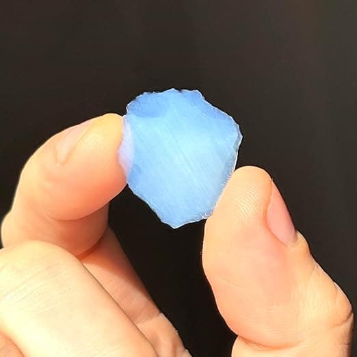 Chunks of blue-tinted silica aerogel, the world’s lightest solid—looks like frozen smoke and used by NASA to catch space dust.