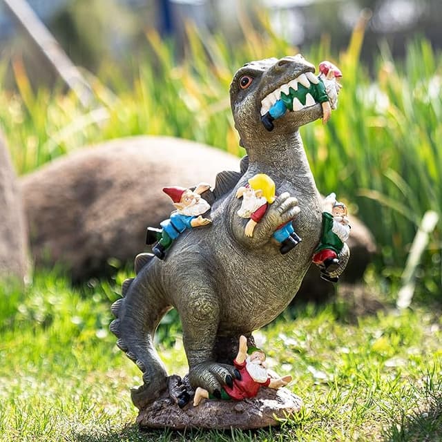 Funny dinosaur-eating-gnomes garden statue for outdoor decor that’s equal parts terrifying and delightful.